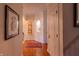 Hallway with hardwood floors, wall niches, and decorative artwork at 5251 Ladywood Bluff Pl, Indianapolis, IN 46226