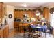 Open kitchen featuring wood cabinets, stainless steel appliances, and an island at 5251 Ladywood Bluff Pl, Indianapolis, IN 46226