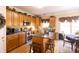 Well-equipped kitchen with wood cabinets, island, and stainless steel appliances at 5251 Ladywood Bluff Pl, Indianapolis, IN 46226