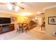 Upstairs bonus room featuring a dining table, a TV and console, and comfortable seating at 5251 Ladywood Bluff Pl, Indianapolis, IN 46226
