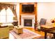 Living room featuring a fireplace and hardwood floors with a cozy seating area at 5251 Ladywood Bluff Pl, Indianapolis, IN 46226