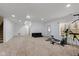 Basement featuring white walls, carpet flooring, stairs, doors to other rooms, and gym equipment at 5307 S State Road 135, Morgantown, IN 46160