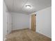 Basement featuring white walls, carpet flooring, a window, and brown curtains at 5307 S State Road 135, Morgantown, IN 46160