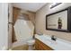 Bathroom featuring neutral paint, tile floors, a vanity, a mirror, and a shower/tub at 5307 S State Road 135, Morgantown, IN 46160