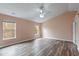 Spacious bedroom featuring two windows and modern ceiling fan with light at 5307 S State Road 135, Morgantown, IN 46160
