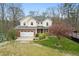 Exterior elevation featuring a two-car garage and landscaped front yard at 5307 S State Road 135, Morgantown, IN 46160