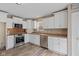 Well-lit kitchen featuring stainless steel appliances, white cabinets, and modern countertops at 5307 S State Road 135, Morgantown, IN 46160
