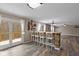 Open-concept living space with bar seating and access to an outdoor deck at 5307 S State Road 135, Morgantown, IN 46160