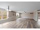 Bright and airy living room with large windows, modern flooring, and neutral paint at 5307 S State Road 135, Morgantown, IN 46160