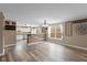 Bright open floor plan with wood-look floors, connecting the living area to the modern kitchen at 5307 S State Road 135, Morgantown, IN 46160