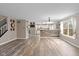 Open living space featuring modern flooring that leads to the kitchen with lots of natural light at 5307 S State Road 135, Morgantown, IN 46160