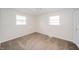 Well-lit bedroom with carpet, large windows, and neutral walls at 5576 N Heritage Ln, Alexandria, IN 46001