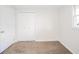 Cozy bedroom featuring neutral carpet, closet, and bright window at 5576 N Heritage Ln, Alexandria, IN 46001