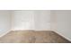 Neutral bedroom with carpet, closet, and white walls at 5576 N Heritage Ln, Alexandria, IN 46001