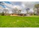 Attractive single-story brick home with green lawn and plenty of sunshine at 5576 N Heritage Ln, Alexandria, IN 46001