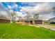 Charming single-story brick home with attached garage and pristine front lawn at 5576 N Heritage Ln, Alexandria, IN 46001