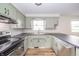 Updated kitchen featuring stainless steel appliances and a subway tile backsplash at 5576 N Heritage Ln, Alexandria, IN 46001