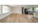 Living room with new wood floors offering an open layout and bright windows at 5576 N Heritage Ln, Alexandria, IN 46001