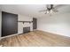 Relaxing living room with ceiling fan, fireplace, and attractive wood flooring at 5576 N Heritage Ln, Alexandria, IN 46001