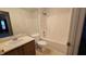 Bathroom featuring bathtub/shower combination, toilet, and vanity with a mirror at 5609 Sweet River Dr, Indianapolis, IN 46221