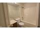 An efficient bathroom includes a bathtub/shower combination, toilet, and vanity with a mirror at 5609 Sweet River Dr, Indianapolis, IN 46221
