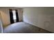 A simple bedroom featuring neutral walls, carpet flooring, and a window with curtains at 5609 Sweet River Dr, Indianapolis, IN 46221