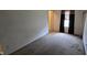 A bedroom featuring neutral walls, carpet flooring, and a doorway leading out of the room at 5609 Sweet River Dr, Indianapolis, IN 46221