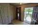 Inviting entryway with tile floor, features a coat closet and an open door to the outside at 5609 Sweet River Dr, Indianapolis, IN 46221