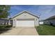 A garage with a white door, grey brick, and a satellite dish above the door at 5609 Sweet River Dr, Indianapolis, IN 46221