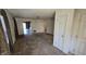 An open living room with neutral carpet, doorways, natural light, and views of the home's interior at 5609 Sweet River Dr, Indianapolis, IN 46221