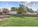 Large backyard with well-maintained lawn, mature trees, and privacy fence, perfect for outdoor activities and relaxation at 5747 Allisonville Rd, Indianapolis, IN 46220