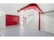 Open basement space with painted floors, ductwork, and staircase, ready for customization and renovation at 5747 Allisonville Rd, Indianapolis, IN 46220