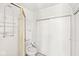 Bathroom featuring a glass enclosed shower, tile flooring, and ample storage at 5747 Allisonville Rd, Indianapolis, IN 46220