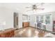 Versatile bonus room showcasing hardwood flooring, natural light, and a cozy atmosphere at 5747 Allisonville Rd, Indianapolis, IN 46220
