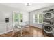 Bright laundry room with a table and chairs, featuring hardwood floors and natural light at 5747 Allisonville Rd, Indianapolis, IN 46220