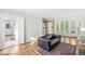 Bright living room with hardwood floors, bay window and white trim at 5747 Allisonville Rd, Indianapolis, IN 46220