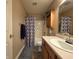 Cozy bathroom features a vanity with ample storage and a shower-tub combination at 5848 Jackie Ln, Indianapolis, IN 46221