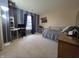 Well-lit bedroom with work station and decor accents that creates an inviting atmosphere at 5848 Jackie Ln, Indianapolis, IN 46221