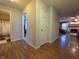Open hallway featuring wood flooring and access to bathroom and living areas at 5848 Jackie Ln, Indianapolis, IN 46221