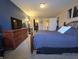 Main bedroom features a large closet, soft carpet and en-suite bathroom access at 5848 Jackie Ln, Indianapolis, IN 46221