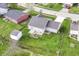 Aerial view of a well-maintained single-story home with a spacious, grassy backyard and mature trees at 5855 La Fleur Ct, Indianapolis, IN 46237