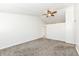 A bright, empty bedroom showcasing vaulted ceilings and neutral carpeting at 5855 La Fleur Ct, Indianapolis, IN 46237