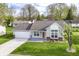 Charming single-Gathering home with well-maintained lawn and two-car garage at 5855 La Fleur Ct, Indianapolis, IN 46237
