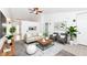 Staged living room featuring neutral tones, modern decor, and ample natural light at 5855 La Fleur Ct, Indianapolis, IN 46237