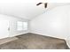 The living room showcases neutral colors and carpeting, along with a large window at 5855 La Fleur Ct, Indianapolis, IN 46237