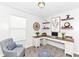 Staged office with a corner desk, shelving, neutral colors and contemporary decor at 5855 La Fleur Ct, Indianapolis, IN 46237