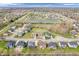 Expansive aerial view of a desirable residential neighborhood featuring lush landscaping and tranquil pond features at 6044 Shallow Crk Ln, Indianapolis, IN 46237