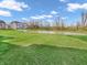 Lush backyard with pond, creating a serene and private outdoor space at 6044 Shallow Crk Ln, Indianapolis, IN 46237