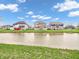 Scenic backyard featuring a tranquil pond surrounded by well-manicured lawns at 6044 Shallow Crk Ln, Indianapolis, IN 46237