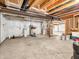 Unfinished basement area, featuring visible pipes and mechanics ready for customized finishing and storage solutions at 6044 Shallow Crk Ln, Indianapolis, IN 46237